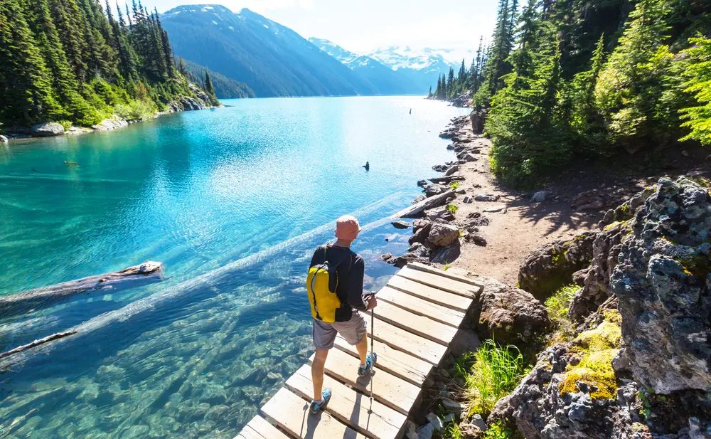 Hiking man in Canadian mountains.  There are a lot of picturesque trails to choose from in Canada.