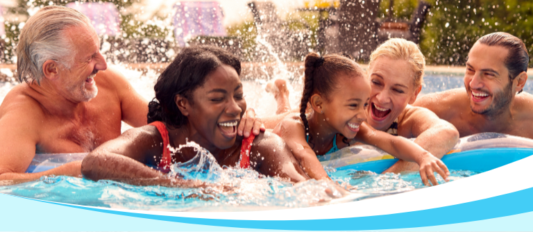 Family enjoying holiday by the pool