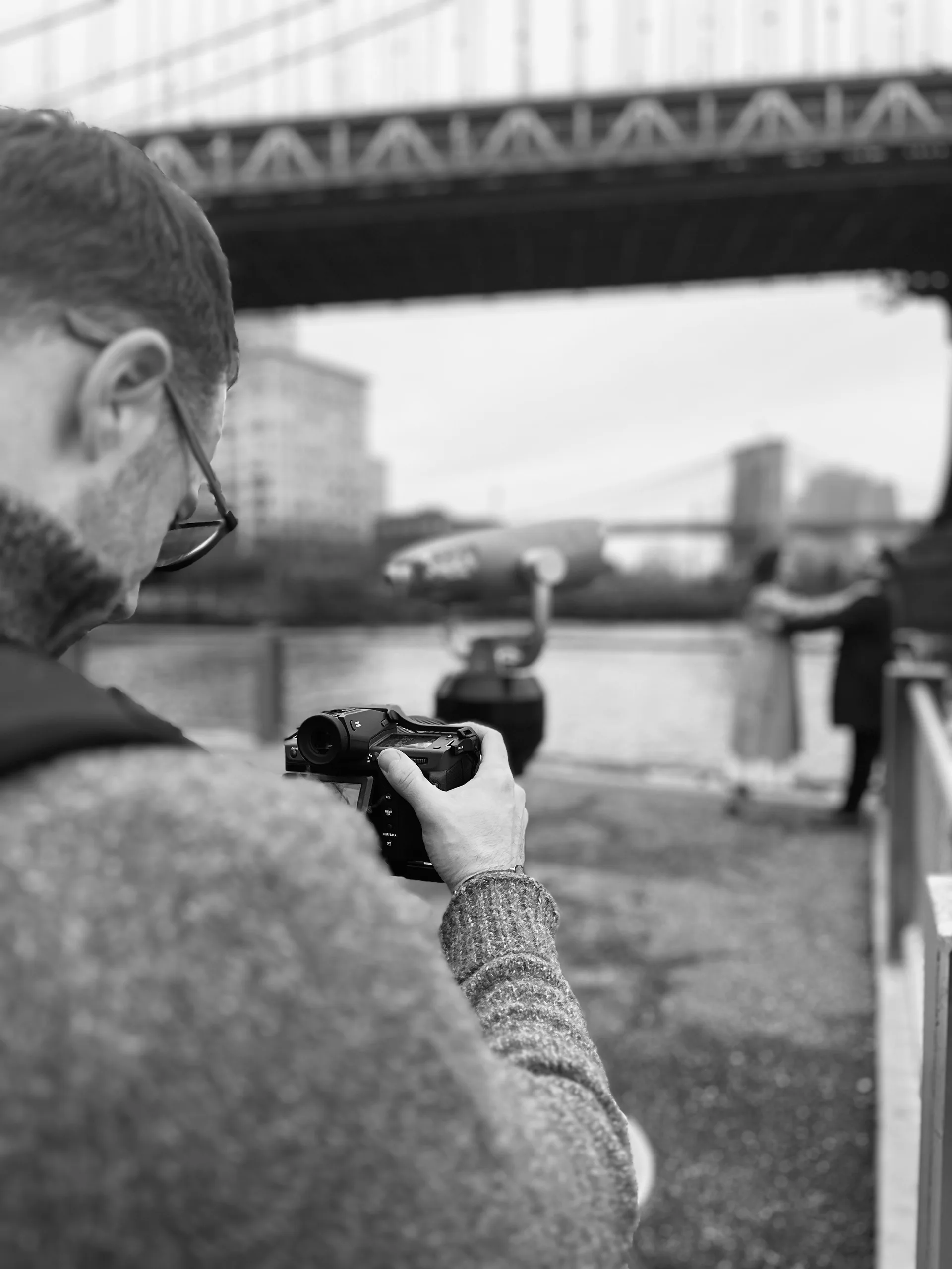 Black and white closeup of photographer with medium format camera