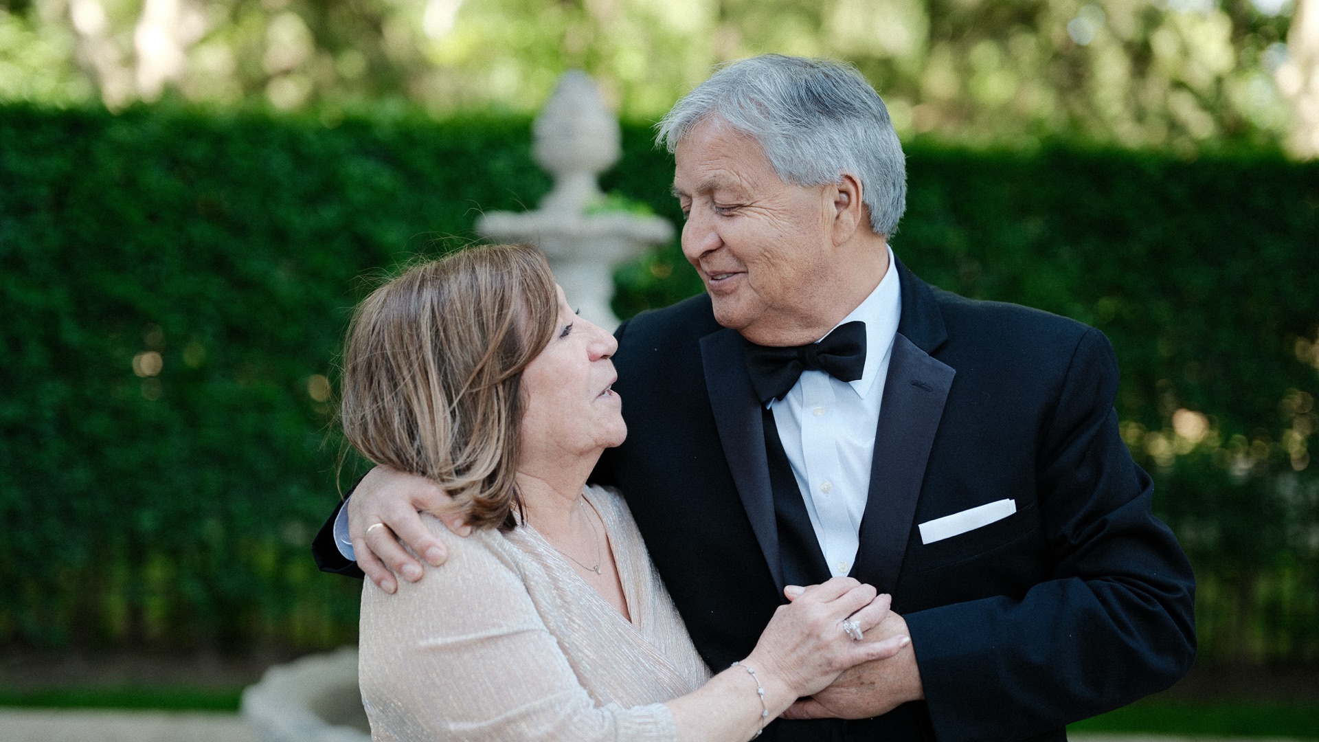 Betty and Wladimir laughing in the garden at Terrace on the Park
