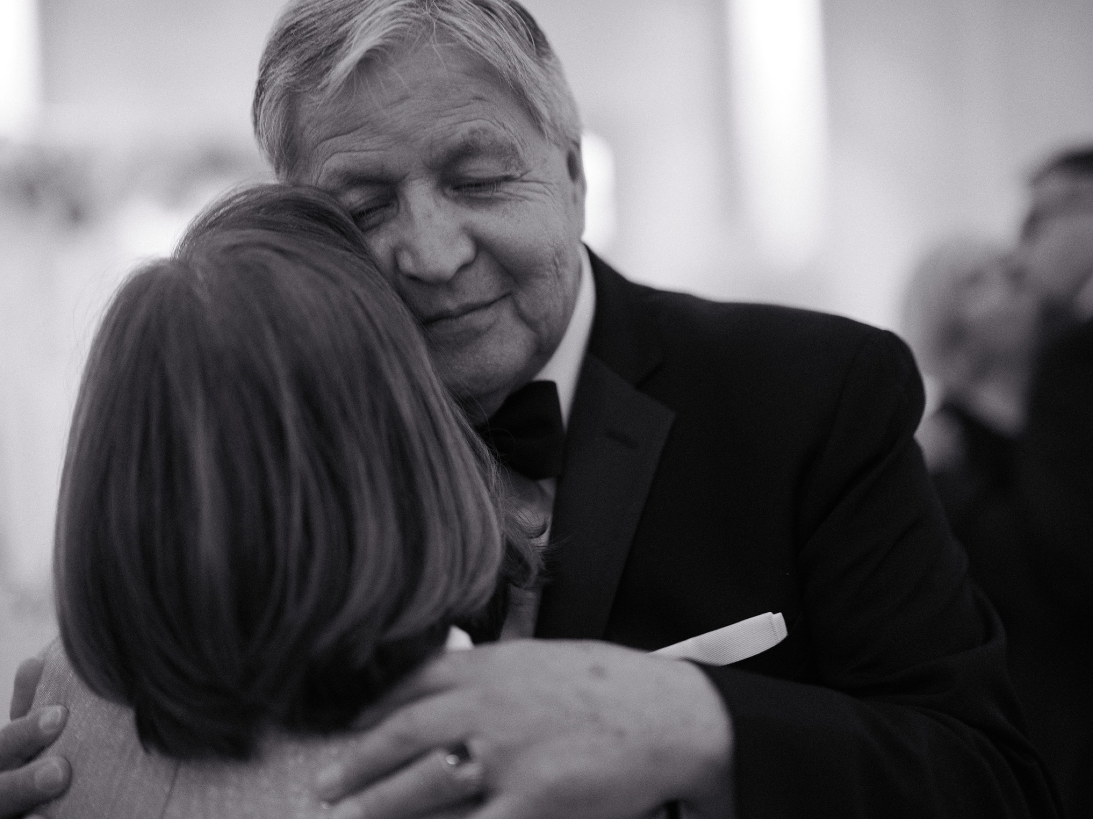 Betty and Wladimir at their 50th anniversary — close intimate hug in black and white.