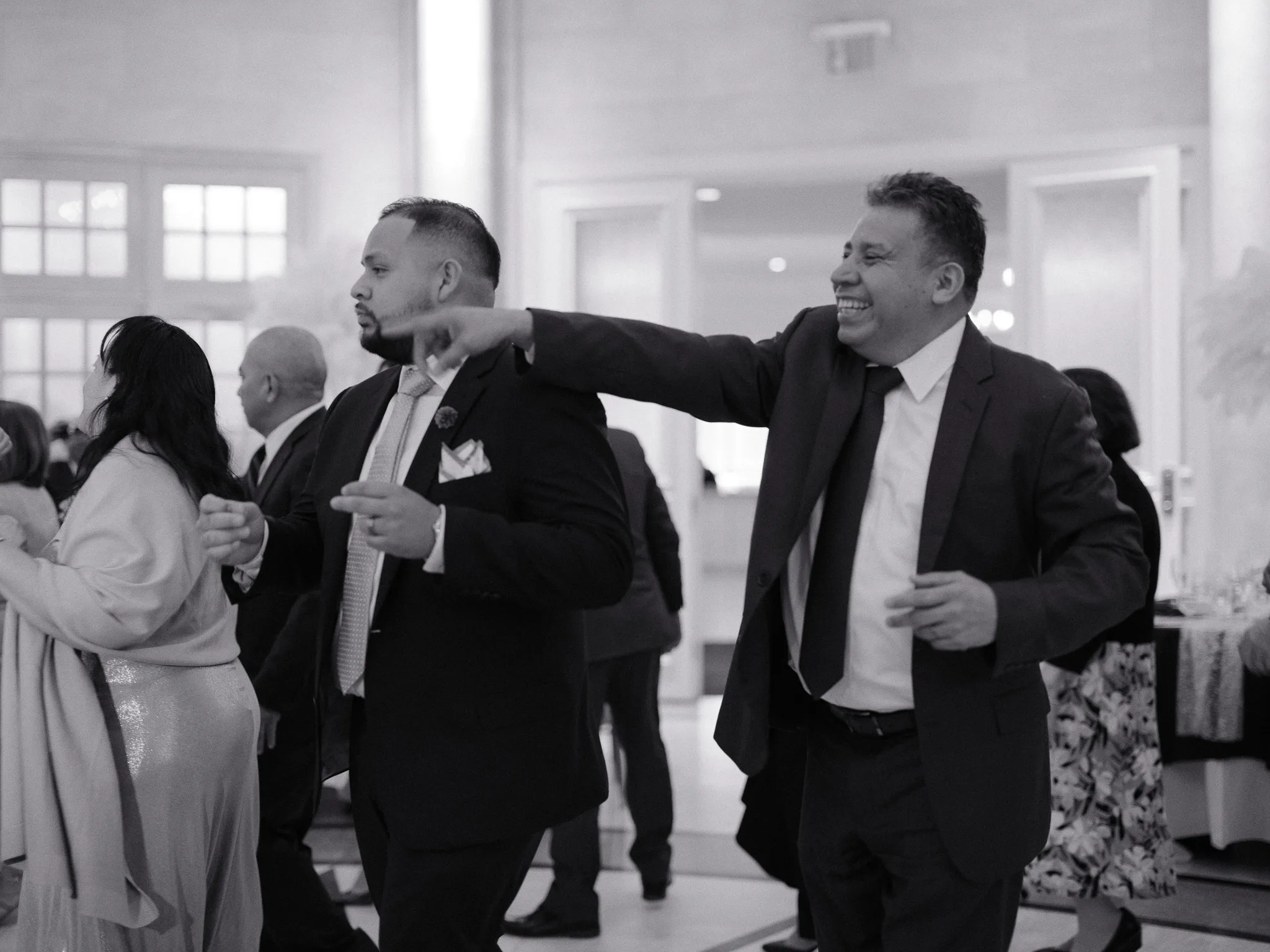 Two guests dancing joyfully