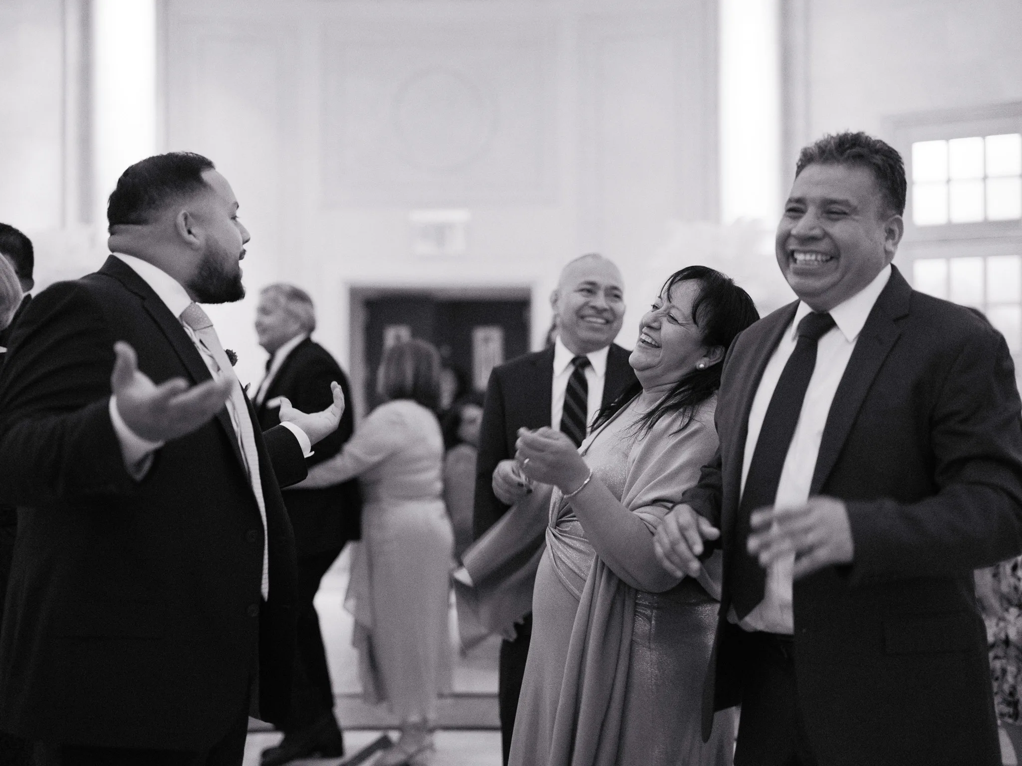 Guests smiling and dancing together