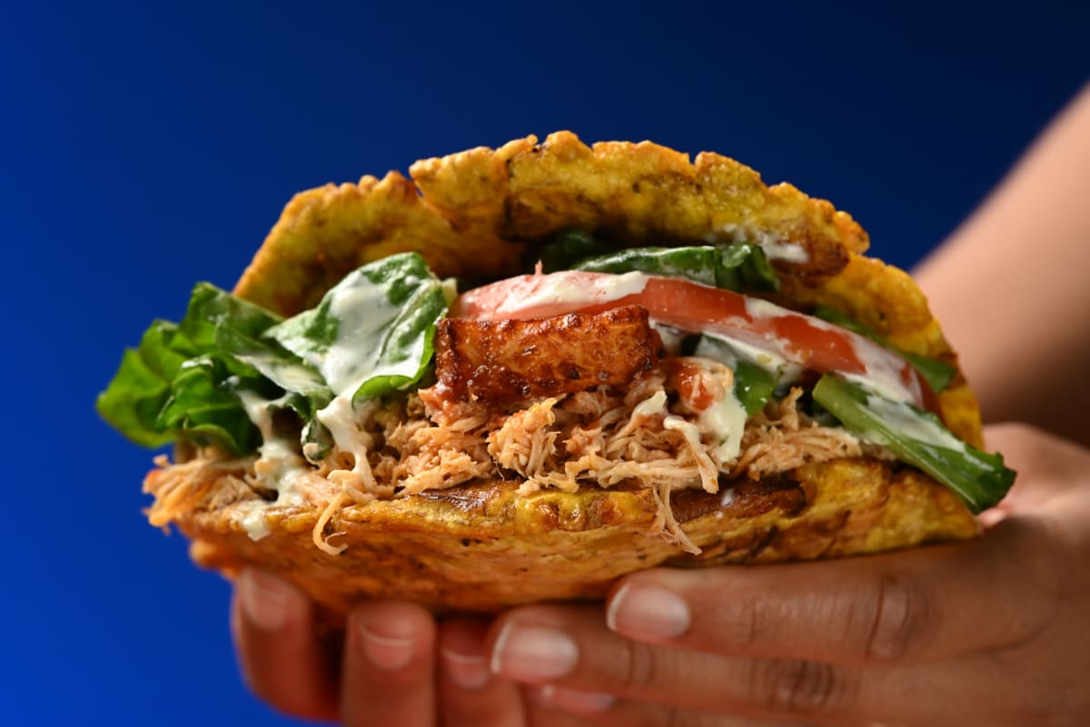 Patacón held in hand