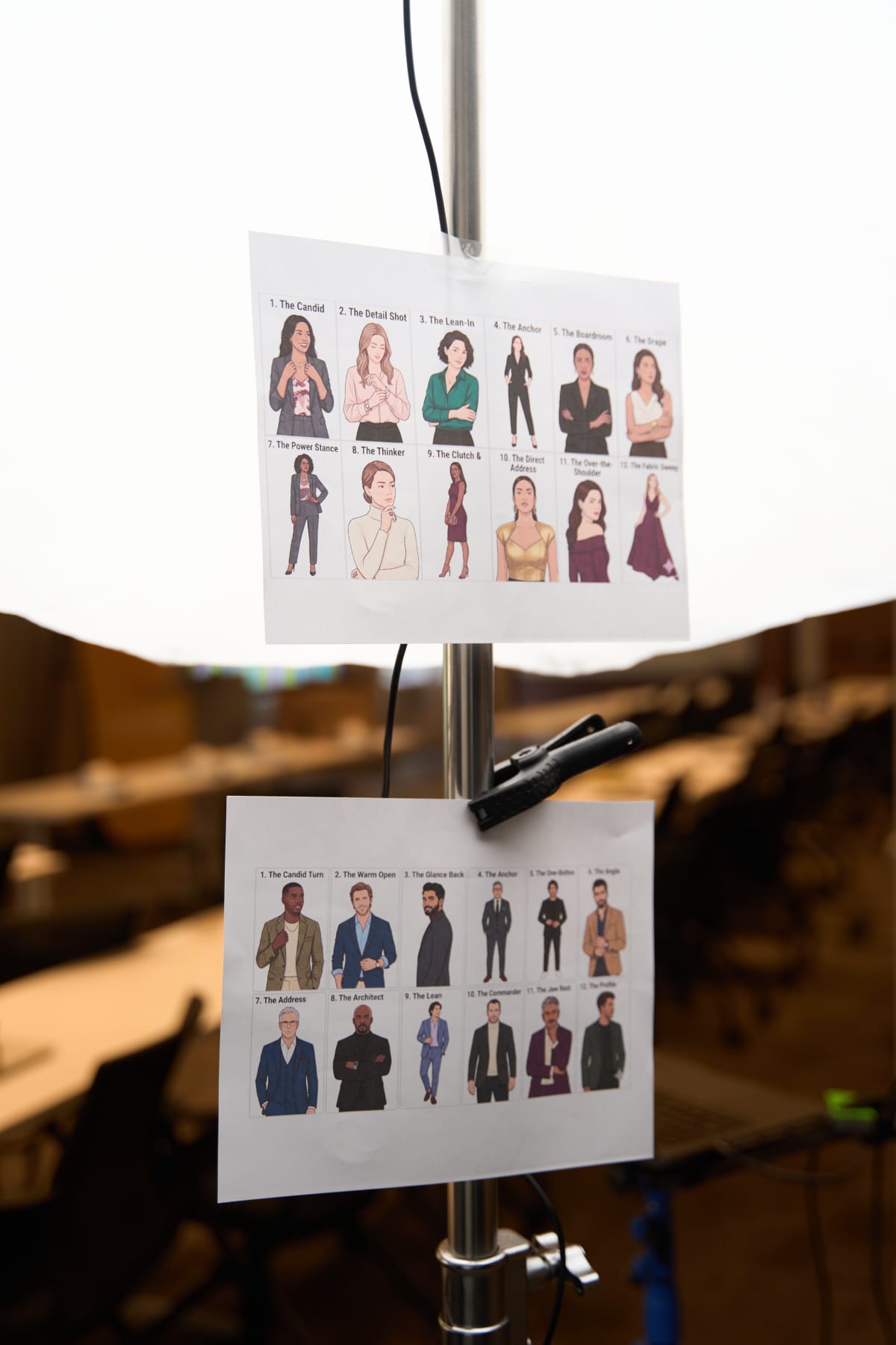 BTS pose guide taped to a light stand during a corporate event headshot setup