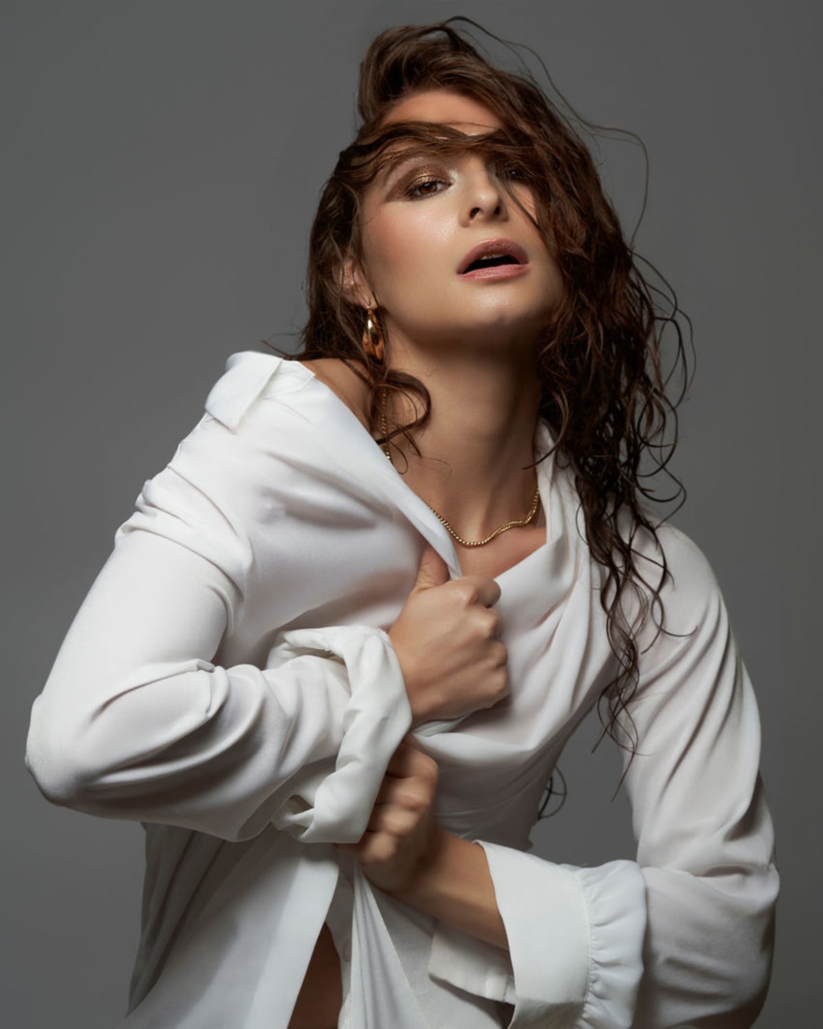White suit styled for a studio fashion portrait