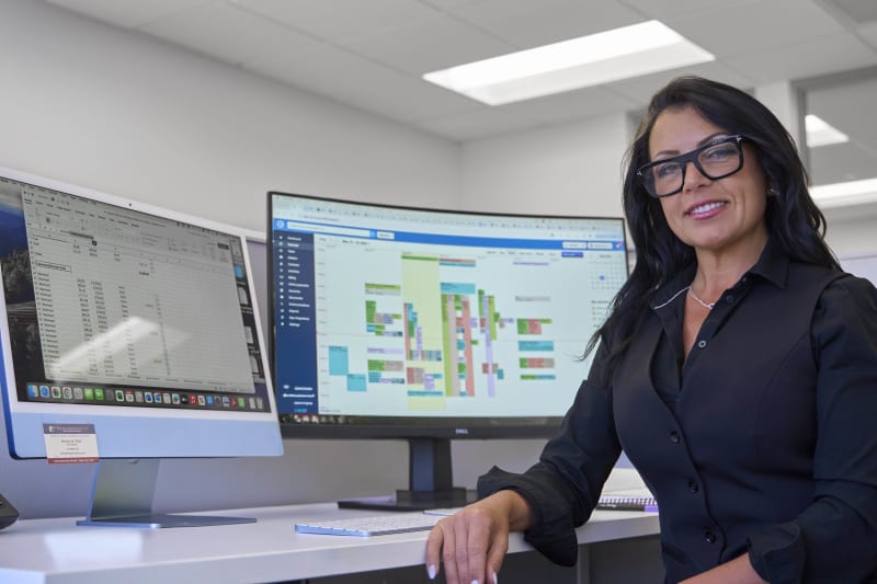 Attorney working at dual monitors NYC law firm office lifestyle photography