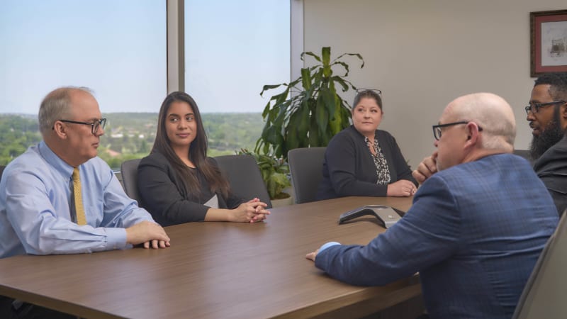 Professional team at conference table NYC law firm office lifestyle photography