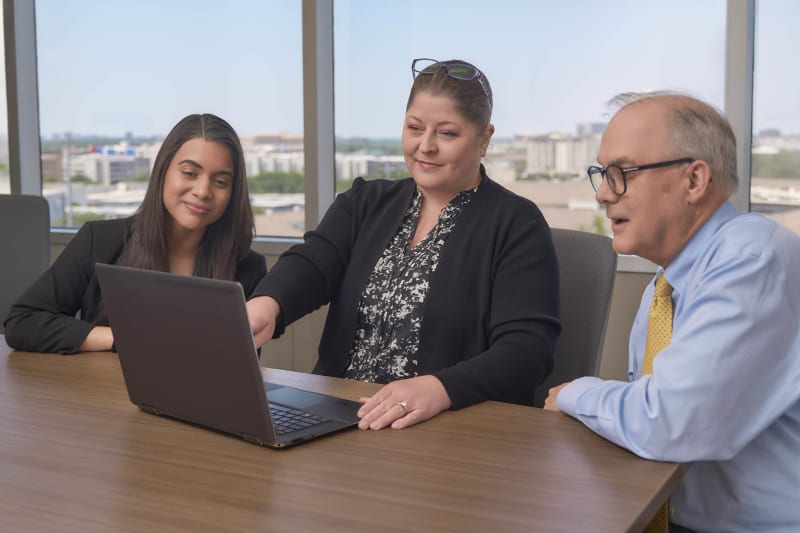 NYC law firm office group meeting collaboration with laptop professional photography