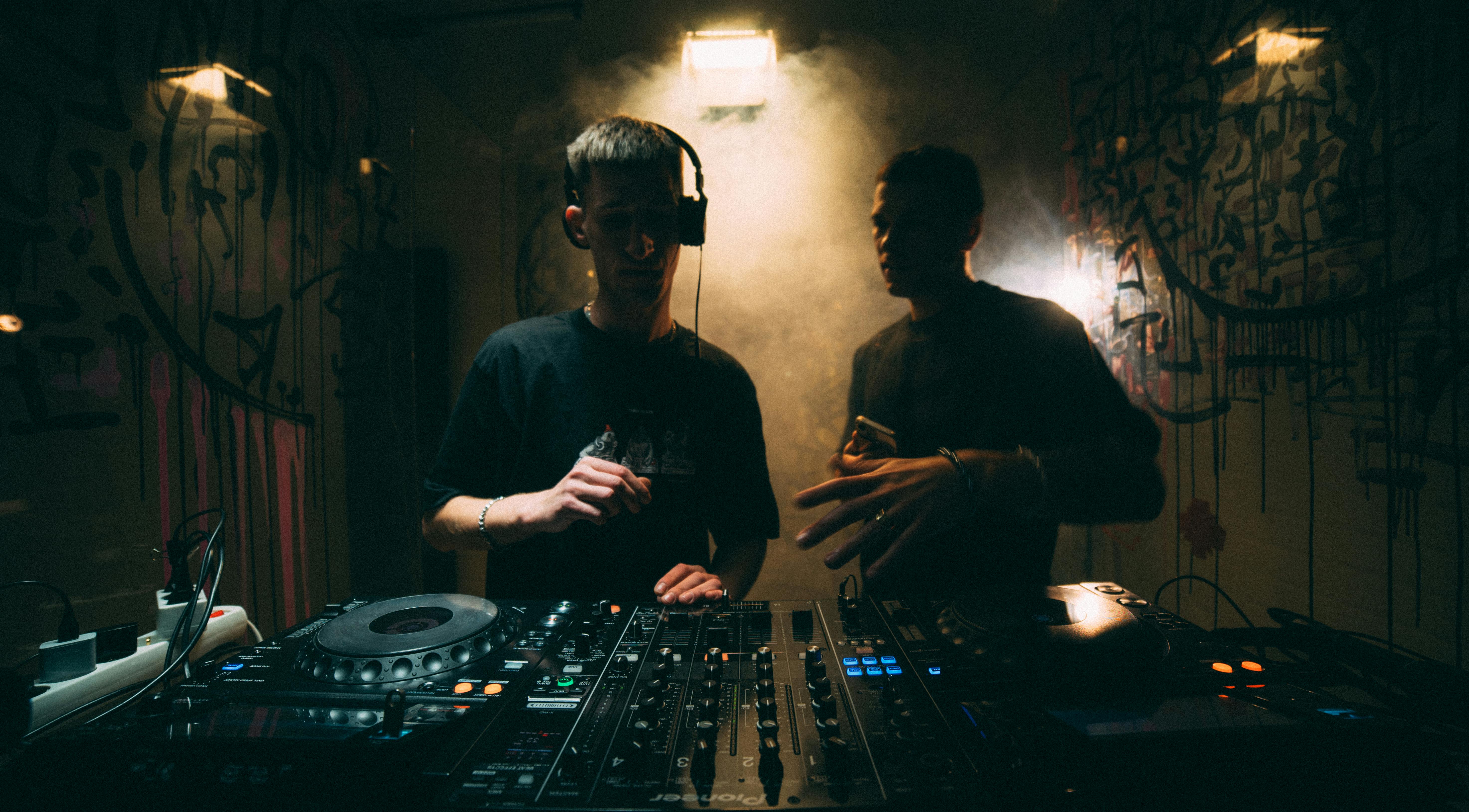 NYC event DJ mixing at club event - professional event coverage photography