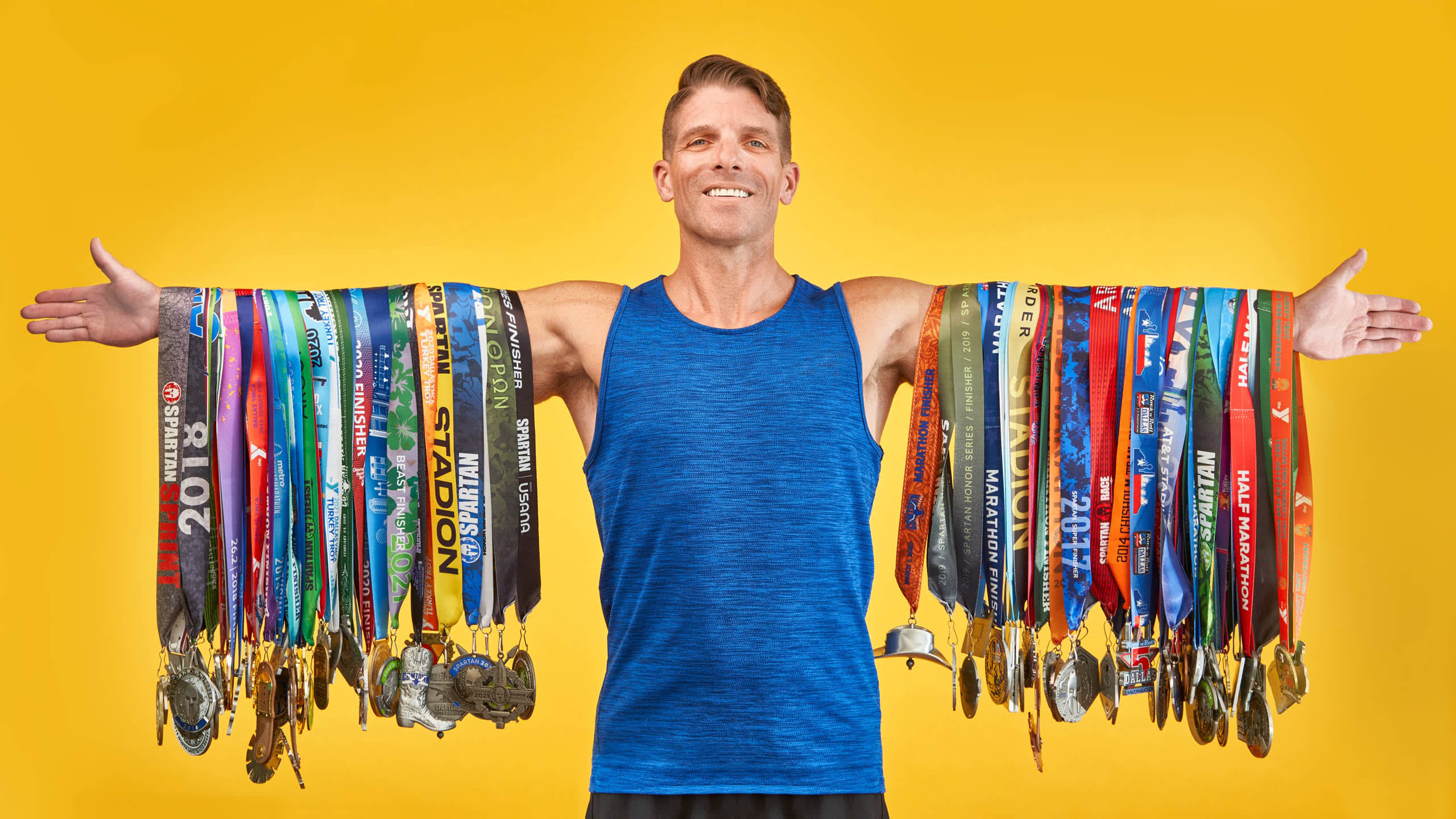 Energetic corporate headshot with yellow background showing warmth and approachability NYC photography