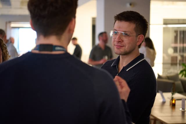 Guests in conversation at a New York event covered by Core Visuals