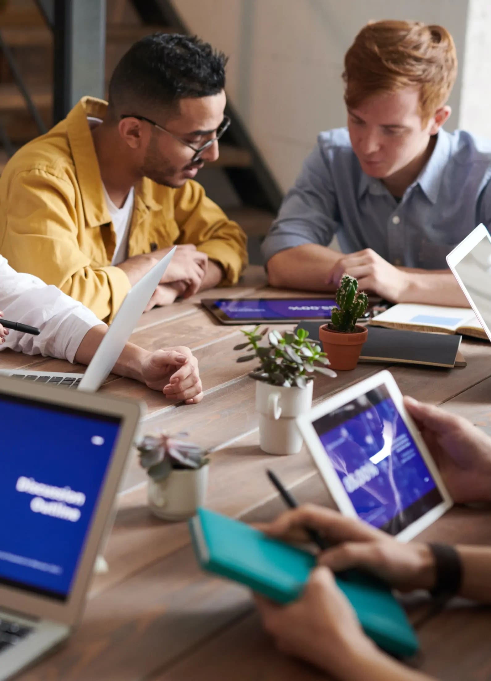 People having a meeting around a table