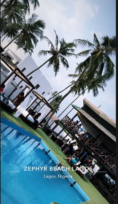 Palm trees and a sparkling blue pool at a Lagos beach hangout