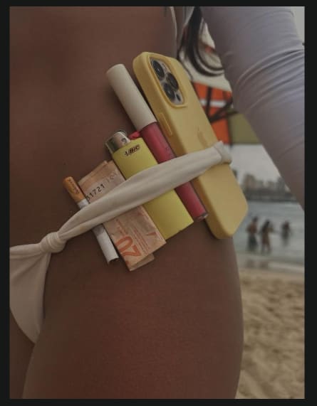 Beach-day essentials tucked into a swimwear tie