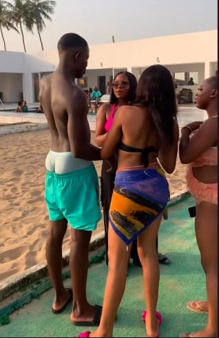 Friends chatting beside a pool