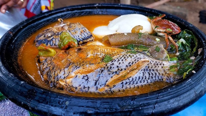 Banku And Light Soup With Big Tilapia