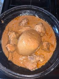 Banku And Groundnut Soup With Goat Meat