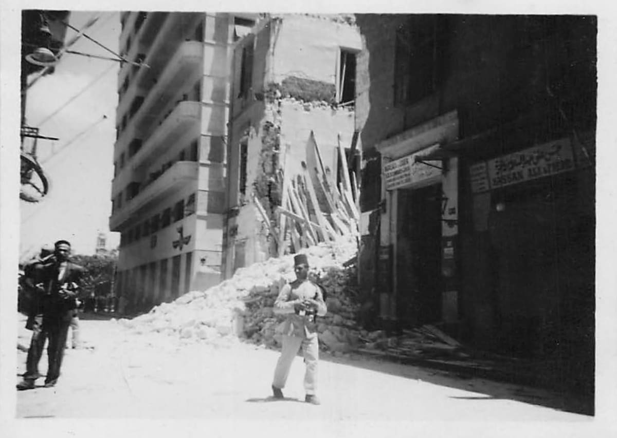This historical photograph shows the aftermath of an aerial bombardment that targeted the city of Alexandria in Egypt in 1941 during World War II. 
