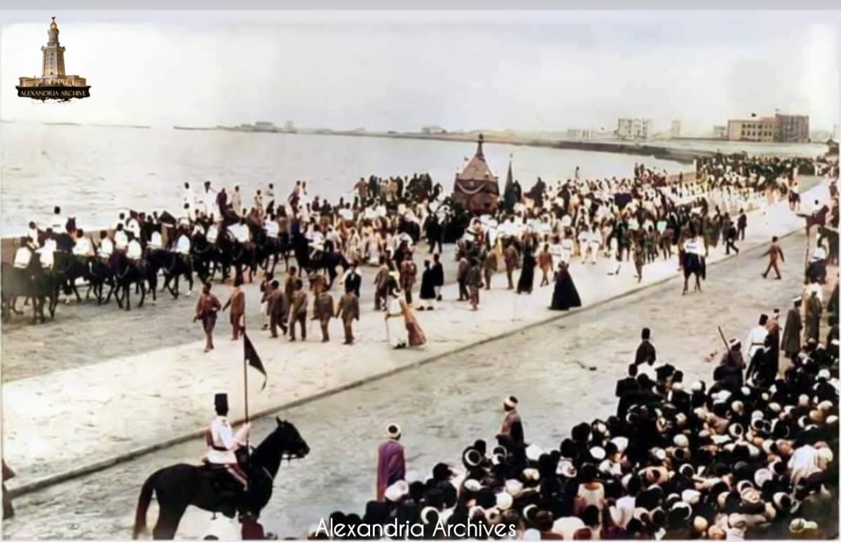 The photograph documents the procession of the Holy Mahmal (the covering of the Holy Kaaba) in 1912 on the Alexandria Corniche, and it was taken by photographers Aziz and Doris. 