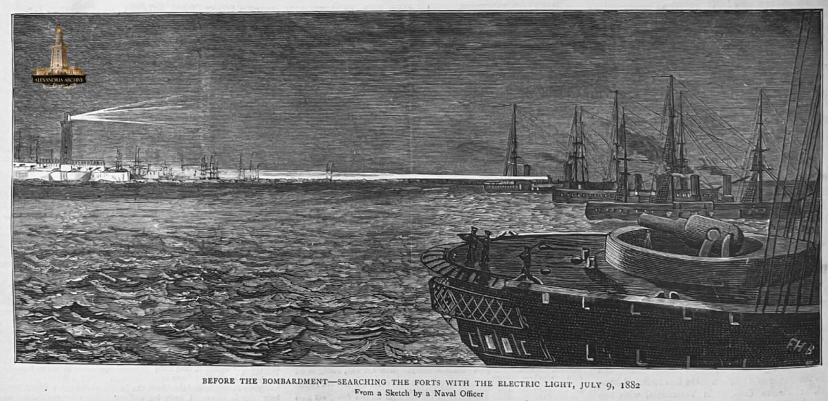 A scene from the bombardment of Alexandria in 1882. The photograph depicts British warships scanning the Egyptian fort using electric lights (searchlights). This scene was captured on July 9, 1882, two days before the actual bombardment began. In the background is visible the Ras El Tin lighthouse, a key target during these events. 