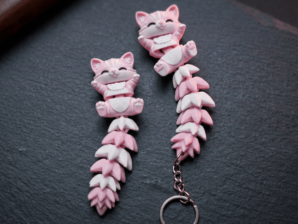 Juguete/llavero de gato flexi lindo con cola esponjosa