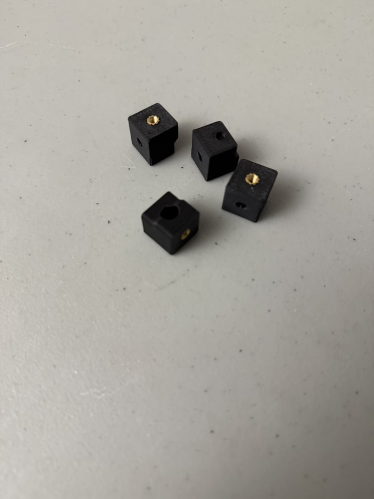 Idler ends with heat set inserts