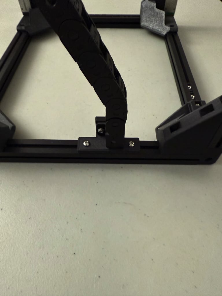 Cable chain mounted to frame