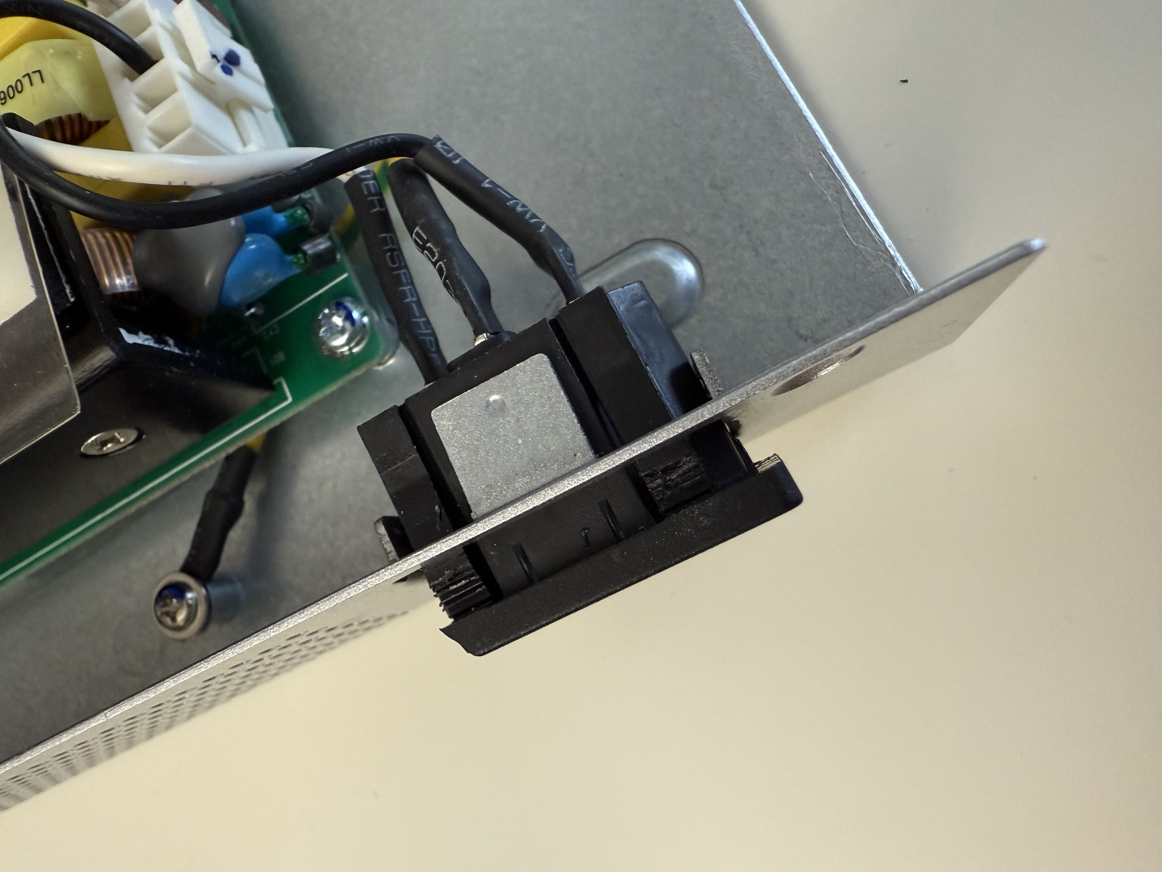 Pushing the tabs and sliding the port out