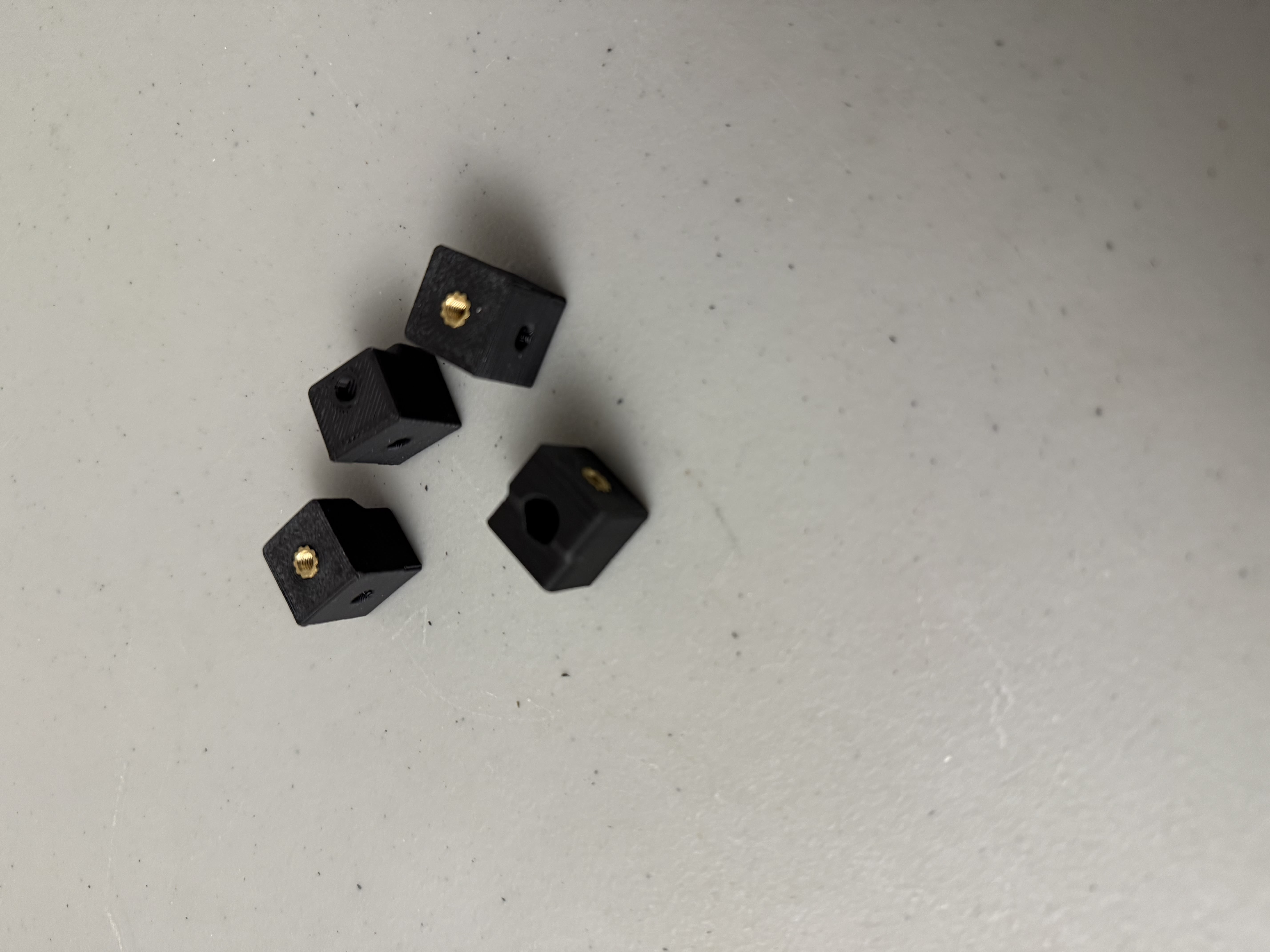 Idler ends with heat set inserts