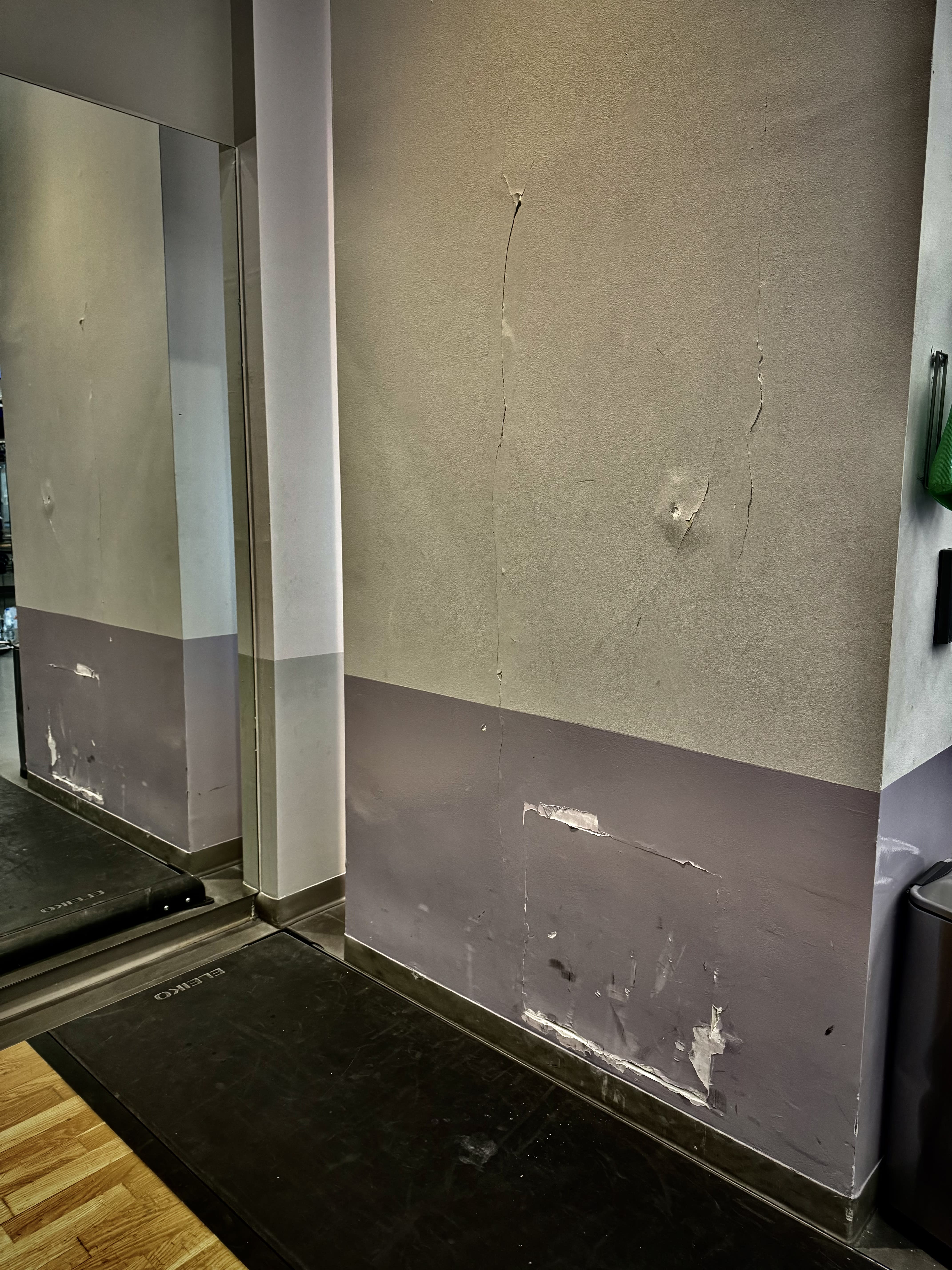 damaged gym wall