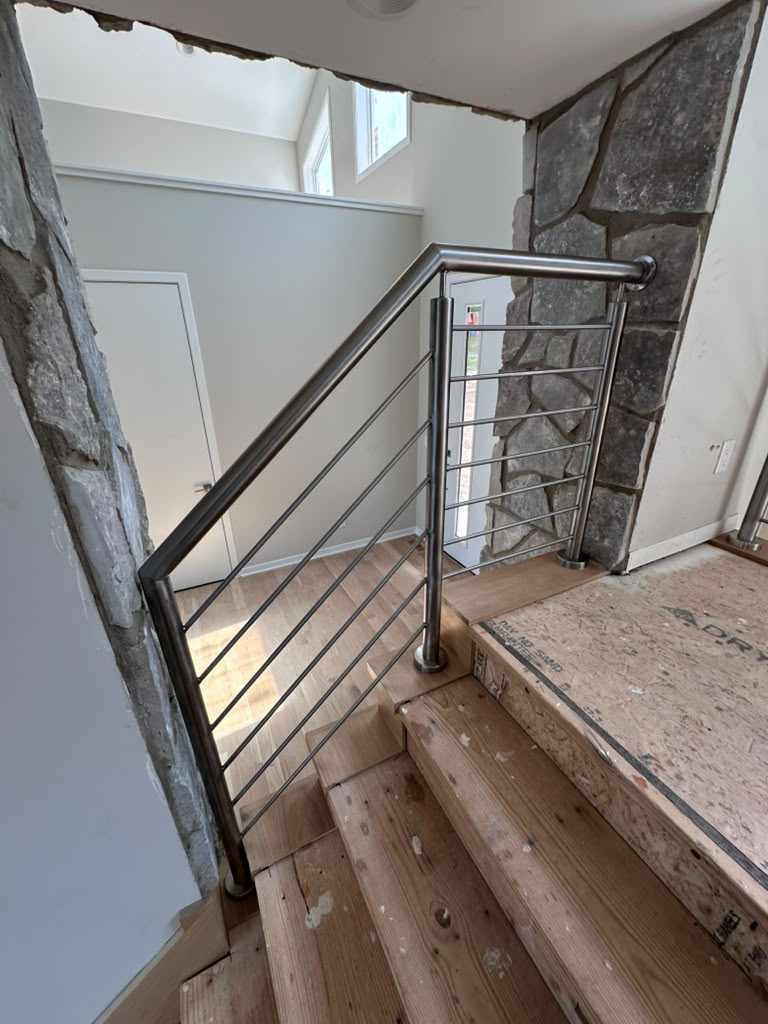 Custom stainless steel handrail installed in a new construction home in Warren, MI