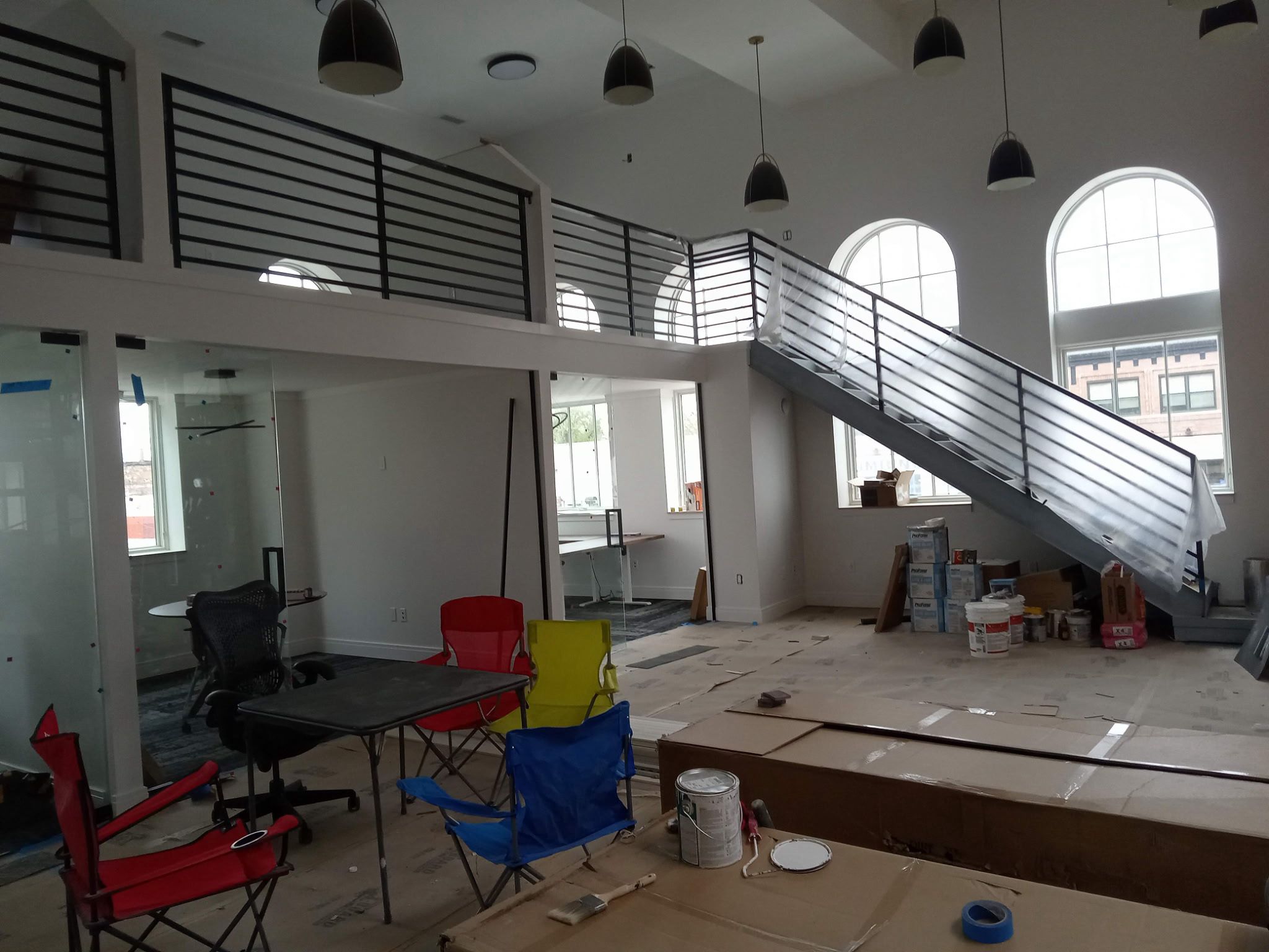Black powder coated staircase railing fabricated and installed in Michigan by Hot Fab Welding