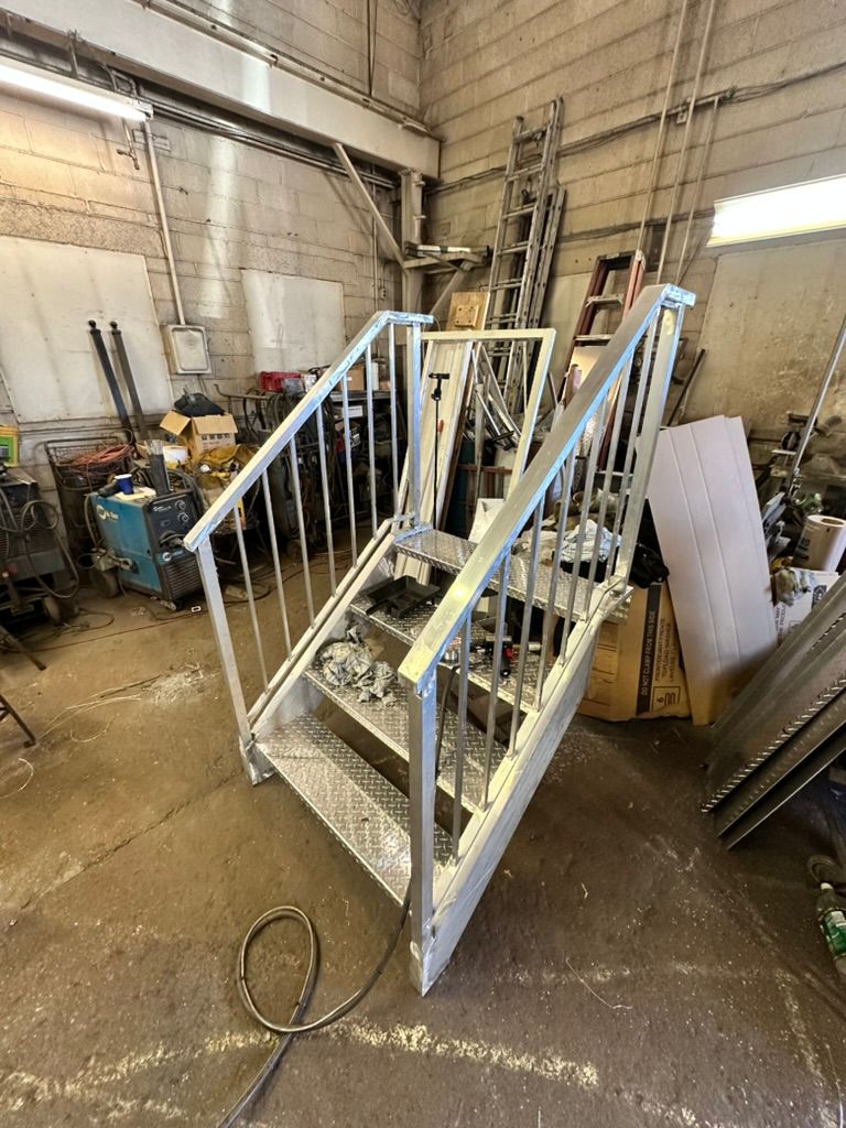 Aluminum staircase with diamond plate treads fabricated in the Hot Fab Welding shop in Warren, MI