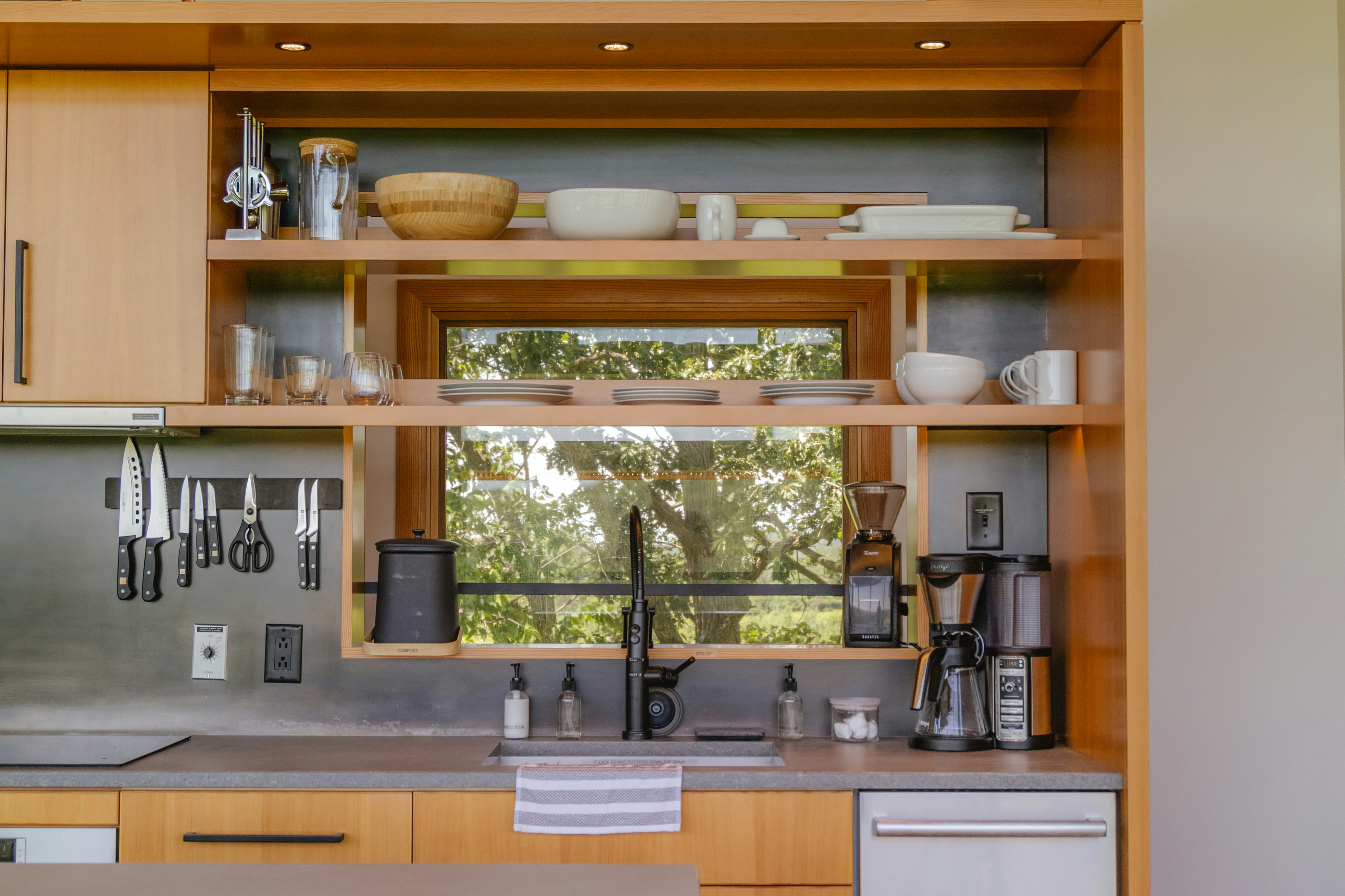 Modern Wood Kitchen with Open Shelving and Integrated Sink