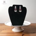 Long earrings featuring white CZs on the upper section, complemented by red CZs in the middle, and finished with elegant drops at the bottom 1