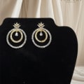Dual Hoop Earrings With a White CZ Drop Hanging In The Center 2