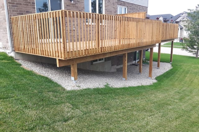 Completed deck supported by helical pile foundation