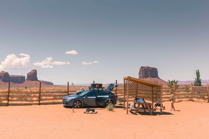 Car with roof rack at Monument Valley campsite — rental car being used for an Arizona road trip
