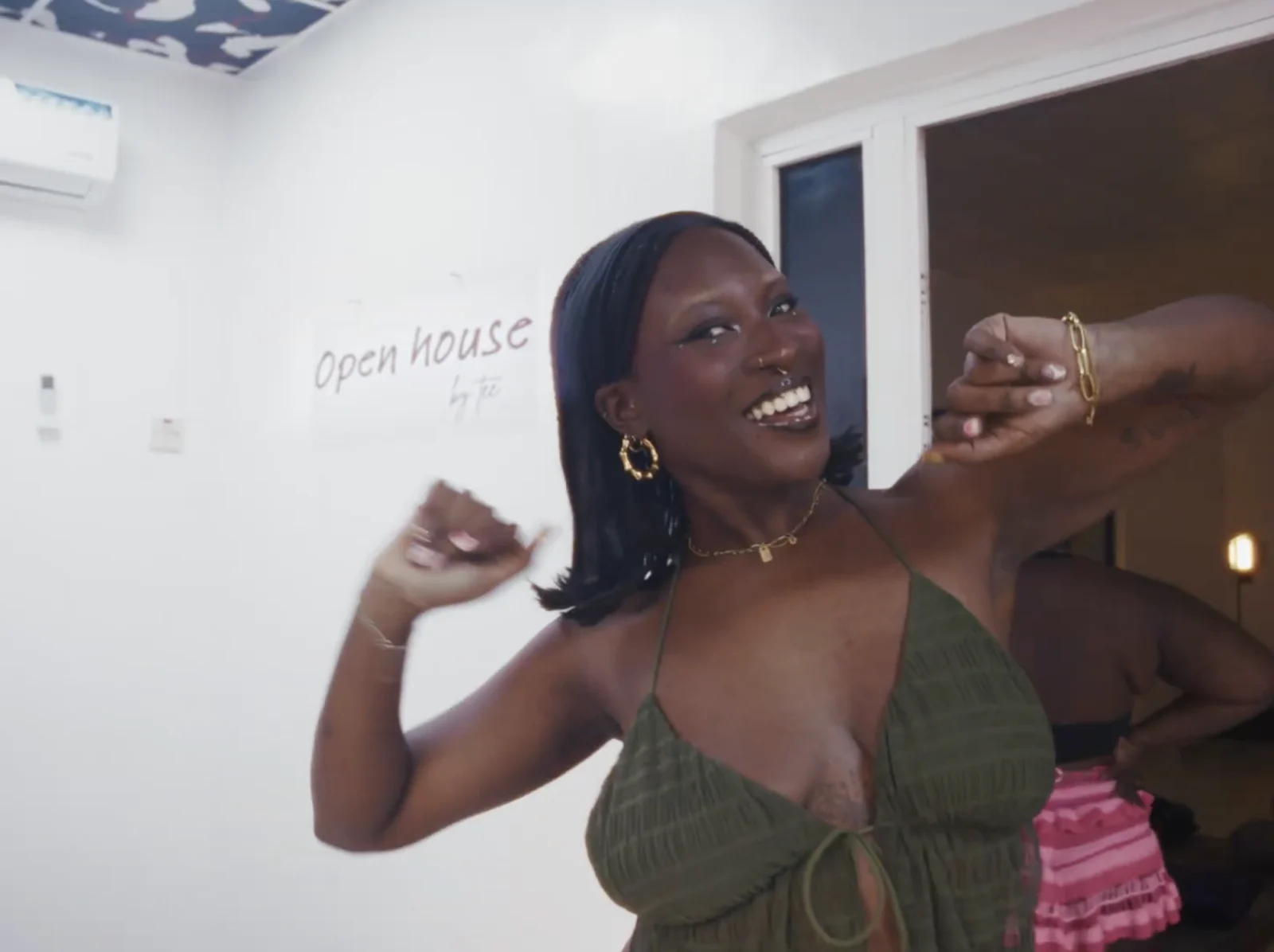 A guest smiling at Tee’s Open House