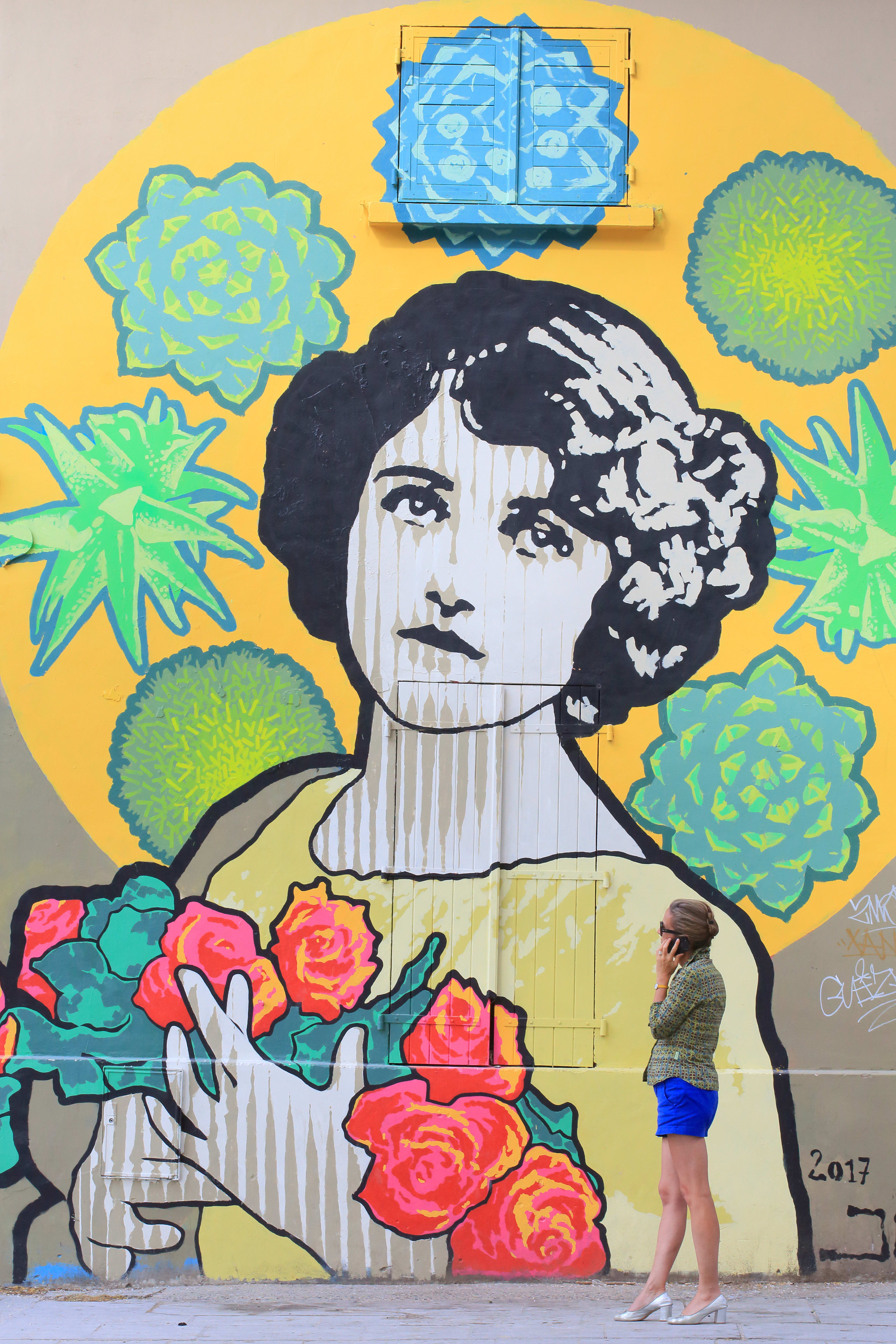 Woman in front of a Street Art work by JBC Art%252C Ourcq street%252C Paris 2017