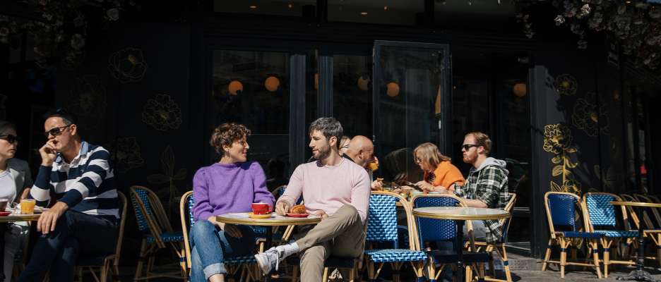 Couple sitting on the terrace of a Parisian café