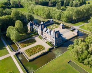 Aerial View Shot of Château de Courances. Drone aerial view with landscaped gardens.