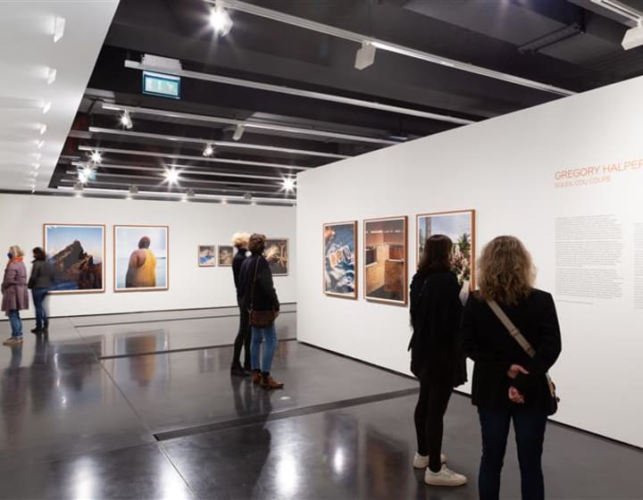 People attending a photo exhibition at the Henri Cartier Bresson Foundation
