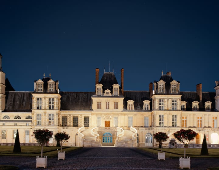 Fontainebleau Castle facade at night