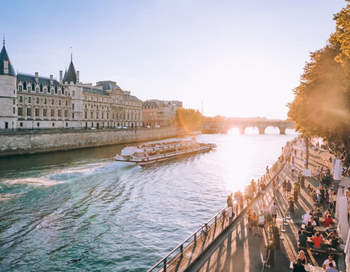 Cruise on the Seine with Paris Plages in the foreground and the Conciergerie in the background