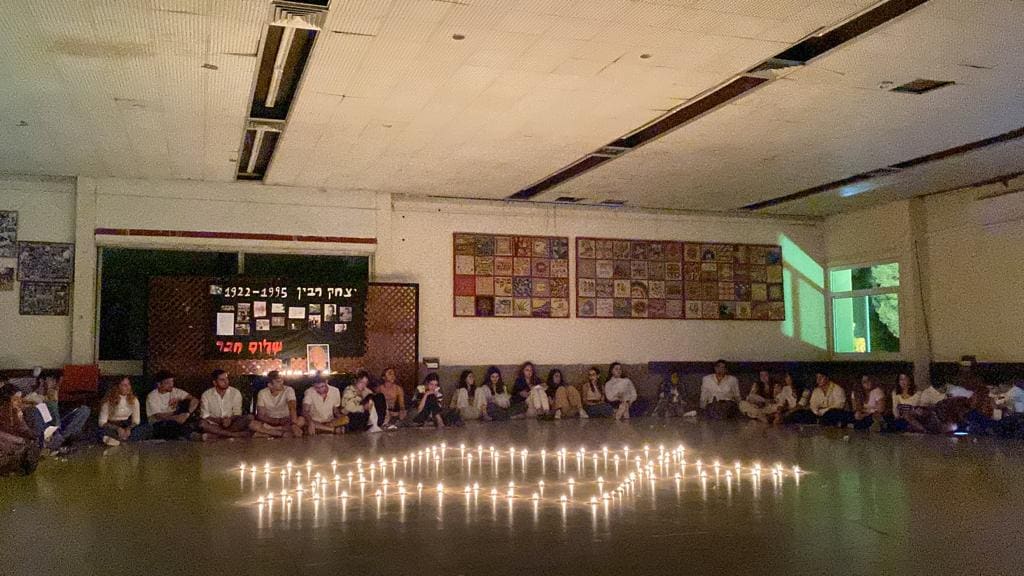 All of the Mechina standing together for a picture on shabbat with white clothes.