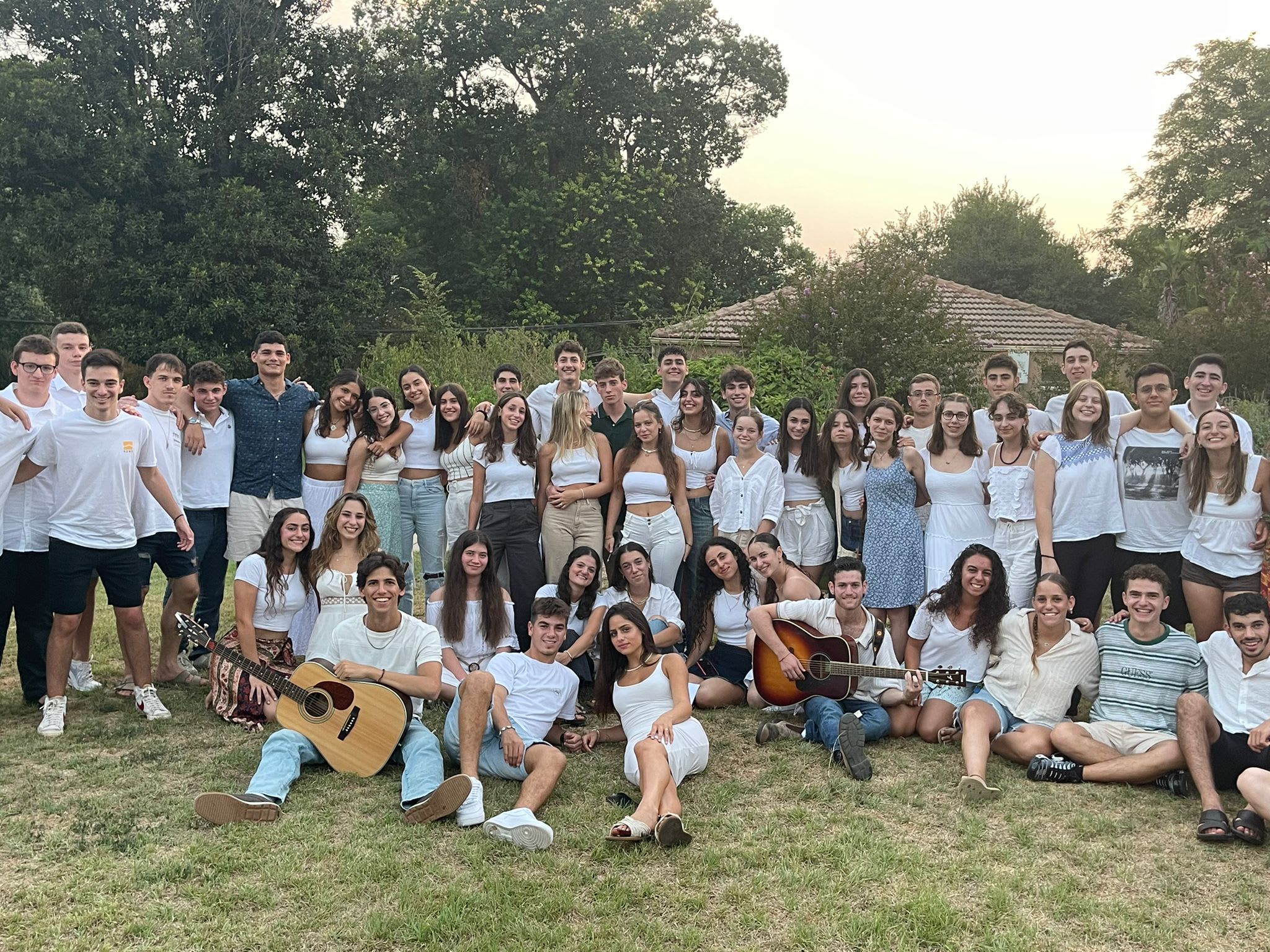 All of the Mechina standing together for a picture on shabbat with white clothes.