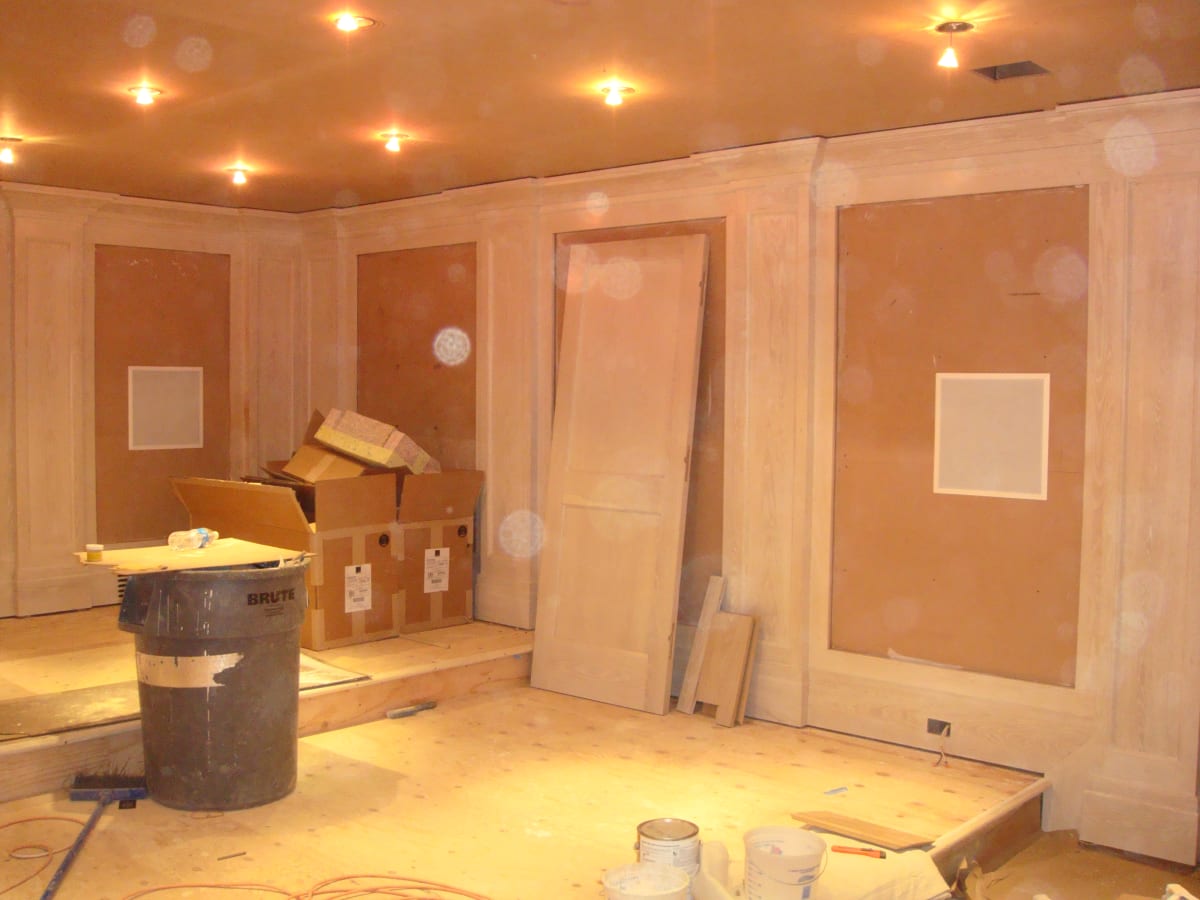 HTE technician evaluating construction pathways for a Hamptons smart home retrofit