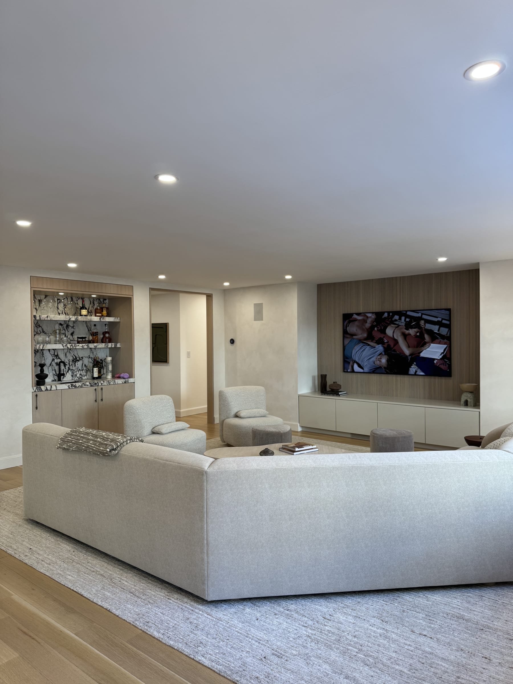 Luxury media room with integrated display and everyday living space